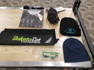lot 183 image: Lot of gloves,  hats, 3XL Patrol Jersey, Sunglasses Dakota Cat Bag