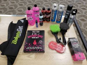 lot 193 image: Cleaning Supplies Micro Fibre Wash Mitt Muc-Off Snow Foam, Degreaser, Silicon Shine, Speed Polish Wunder Shine, Brushes Polishing Cloth Dakota Cat Bag
