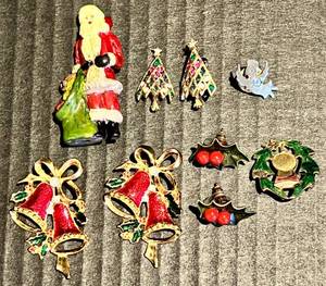 lot 105 image: Vintage Christmas Themed Set of items - Pewter Santa, Bells, Holly, and Trees