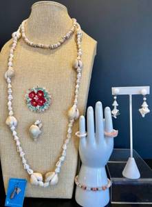lot 159 image: Collection of Seashell Jewelry including Necklaces, Rings, Bracelet, Brooches and Sterling Silver Charm