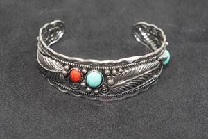 lot 38 image: Womens Silver Tone Western Feather Bracelet - Turquoise Stone