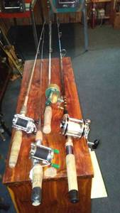 lot 617 image: Collection of 4 Vintage Fishing Reels on Rods.