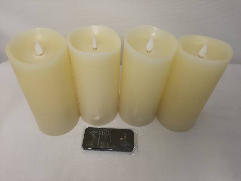 lot 709 image: Illure 4-Pack 7 Inch Lumi360 Battery Operated Candles Ivory w Remote