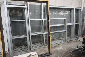 lot 145 image: variety of metal window frames. 27x99. 80x10