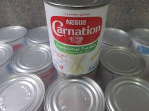 lot 226 image: 24- 12 oz Nestle Carnation Evaporat...