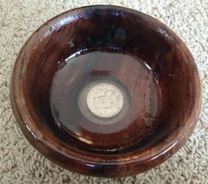 lot 83 image: Gorgeous Hand Carved & Handcrafted Wooden Bowl With Genuine Eisenhower Dollar in Bottom