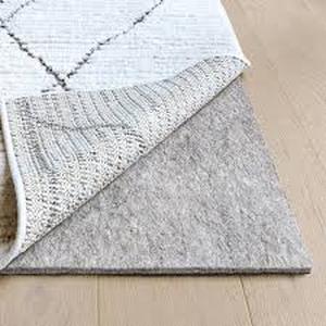 lot 23 image: RUGPADUSA Essentials 8 ft. x 10 ft. Rectangle Felt  Rubber Non-Slip 14 in. Thick Rug Pad  Customer Returns See Pictures