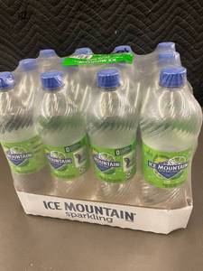 lot 439 image: Pack of 12 Ice Mountain Sparkling Lime Water Bottles