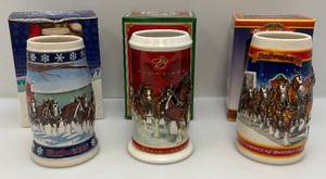 lot 174 image: Collectible Budweiser Holiday Beer Steins  (NIB)
