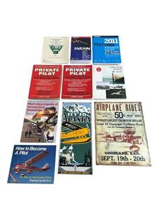 lot 40 image: Andre Rooney Fly Alaska Washington Airways Porcelain (8 x 18) Advertising Sign, Replicat Secrist Flying Circus Metal Sign, and Aviation Books