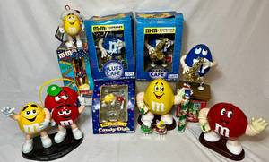 lot 103 image: M & Ms Collection of Dispensers, Ornaments, Lunch Box, Tin, Candy Dish, Time Capsule and Figurines