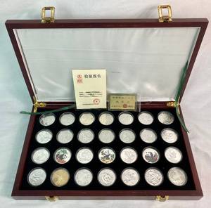 lot 7 image: Set of 28 Collectible 1oz. Silver Panda Coins