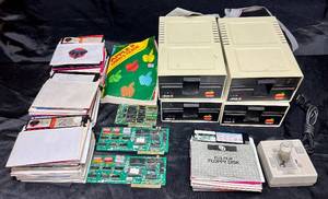 lot 124 image: Vintage Apple II - Two Super Serial Cards, 4 Disk Drives, Joystick and Apple Disks