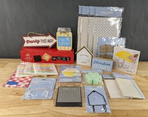 lot 287 image: Brand New Napkins, Tin Magnet, Mini Canvas, Shaped Hook Dcor, Dish Sponge, Planner, Desktop Calendar, Basket Tags, Shelf Liners, Etc. D