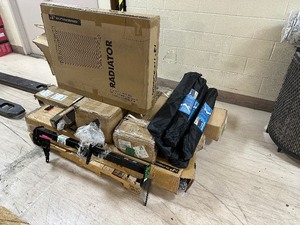 lot 99 image: Pallet of Auto Parts Customer Returns & New including - 3 ton floor jack, Radiator, Tow Hitch, Drive Shafts, Shocks & More