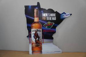 lot 64 image: Captain Morgan and MN Wild Raised Metal Sign