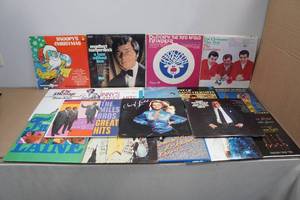 lot 116 image: Assorted Vinyl Records -Snoopys Christmas, Rudolph, Elvis, Hermans Hermits