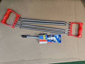 lot 38 image: Lot of Bike Stander Luxe ( New) and Spring Resistance Band