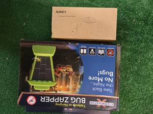 lot 51 image: Lot of 2 items AUKEY Car Magnetic Phone Mount  and a Tabletop or hanging Bug Zapper Xterminator (New)