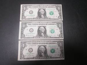 lot 26 image: 3 Error Off Center $1 Bills...