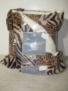 lot 154 image: Comfort Bay 50 in. x 60 in. Microlight Berber Throw-Leopard Tiger Print