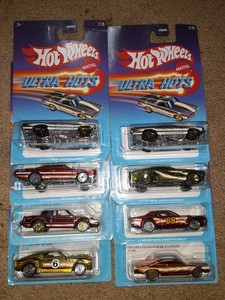 lot 323 image: Hot Wheels ultra hots muscle car Ford GM Mustang Monte Carlo El Camino Dodge. All clean cards stickers on 2 cards. As shown.
