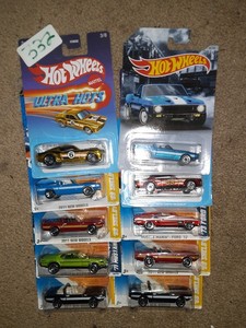 lot 332 image: Hot Wheels Ford muscle 1969,70,73 Mustang Shelby. One wrinkle card. As shown.