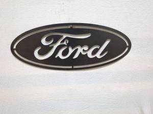 lot 6 image: Vintage Ford Logo Wall Sign - Metal Decor