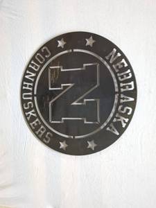 lot 85 image: Metal Wall Art Sign - Nebraska Cornhuskers Logo