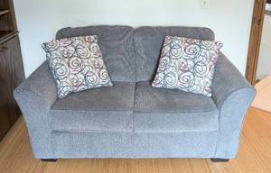 lot 15 image: Grey Upholstered Ashley Furniture Loveseat