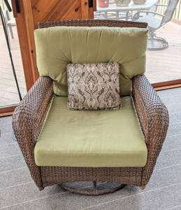 lot 30 image: Oversized Wicker Swivel Rocking Chair