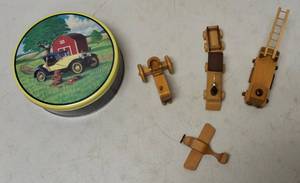 Miniature Wooden figures (1) Airplane (1) Fire Truck (1) Train (1) Tractor & (1) Decorative Cookie Tin
