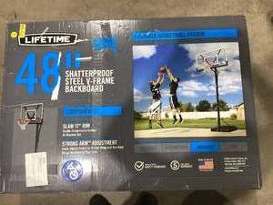 lot 669 image: Lifetime New Adjustable Portable Basketball Hoop, 48 Polycarbonate (90585)