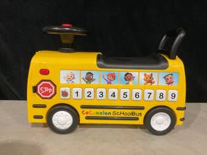 lot 464 image: CoComelon School Bus Ride-on with Letters, Numbers, & Music