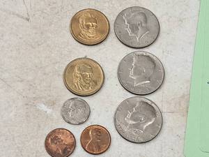 lot 180 image: Lot of (8) Vintage Assorted Vintage Coins - Grant Dollar, Polk Dollar, 1973 Kennedy Half Dollar, 1975 Cent, 1988 Cent, 1994 Kennedy Half Dollar, 1776-1976 Kennedy Half Dollar, 1994 Dime
