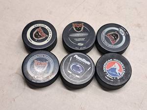 lot 173 image: Lot of (6) Assorted Hockey Collectors Pucks - Philadelphia Phantoms AHL Official Game Pucks, Penn State Hockey, AHL Official Game Pucks