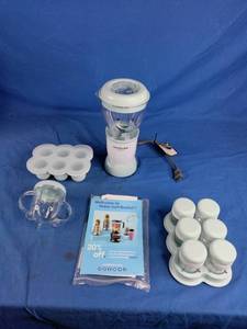 lot 14 image: NutriBullet Baby Bullet Blender with Storage Containers