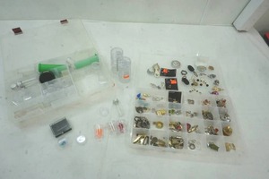 lot 46 image: Jewelry assortment of pendants, earrings, beads, rings, and small containers