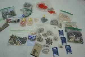 lot 47 image: JewelryBeads large assortment of beads, clasps, necklaces, cross pendants, metal beads.