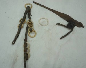 lot 205 image: antique corn husking glove and antique harness line spreader