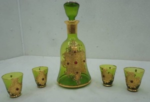 lot 217 image: Antique green glass decanter set. Sticker on bottom says made in Italy