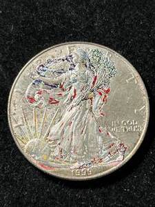 lot 53 image: 1999 AMERICAN SILVER EAGLE IN COLOR 1 TROY OZ .999 FINE SILVER