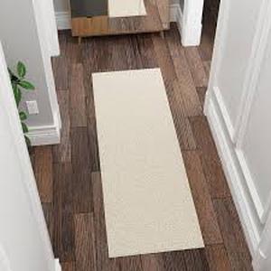 lot 33 image: Lot of Ottomanson Mirage Collection Non-Slip Rubberback Solid Soft Cream 2 ft. x 6 ft. Indoor Runner Rug    Customer Returns See Pictures