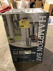 lot 40 image: Hampton Bay 48000 BTU Stainless Steel Propane Standing Patio Heater with Wheels  Customer Returns See Pictures