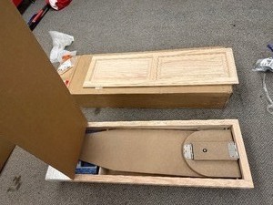 lot 269 image: Oak Raised Panel Cabinet With Drop Down Ironing Board  - New Open Box