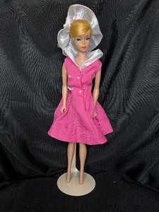lot 24 image: VINTAGE BLONDE BARBIE WITH PINK DRESS AND STAND
