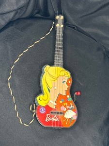 lot 28 image: VINTAGE BARBIE TOY GUITAR