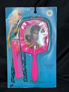 lot 32 image: VINTAGE IN PACKAGE DRESS UP MIRROR AND COMB 1974