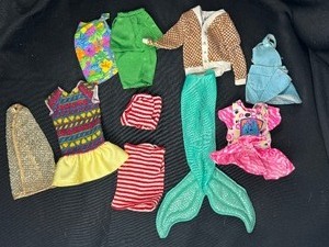 lot 63 image: LOT OF DOLL CLOTHES WITH KEN SWEATER