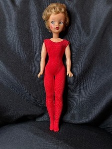 lot 73 image: VINTAGE TAMMY DOLL WEARING RED OUTFIT